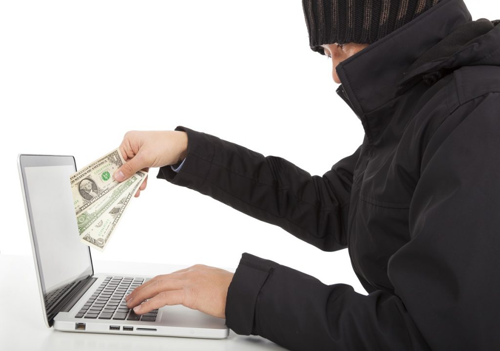Hacker holding money