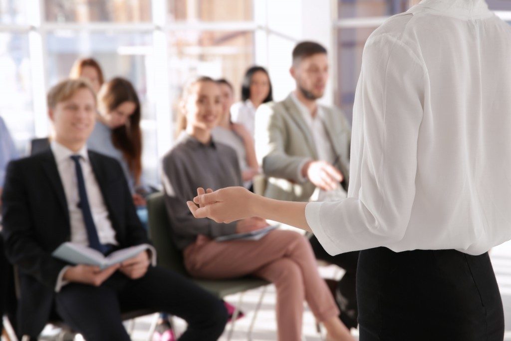 Speaker in front of employees being trained