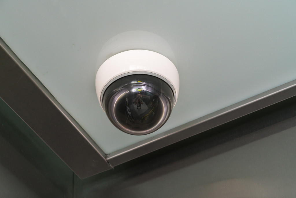 Security camera installed on the ceiling of a store.